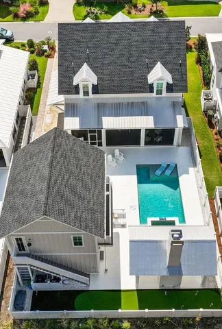 an aerial view of a house with a swimming pool