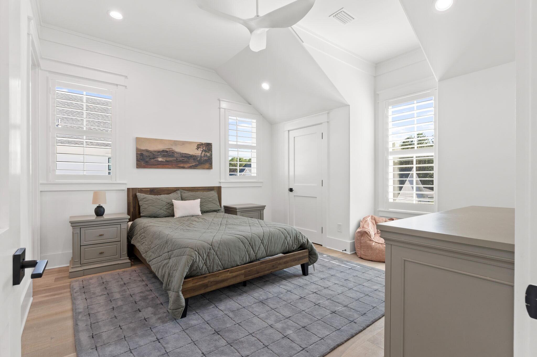 92 Rosecourt Street Inlet Beach, FL 32461 - Photo 32 of 65 a bedroom with a bed and a table