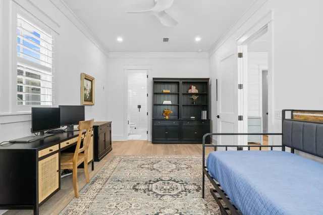 a bedroom with a bed and a dresser