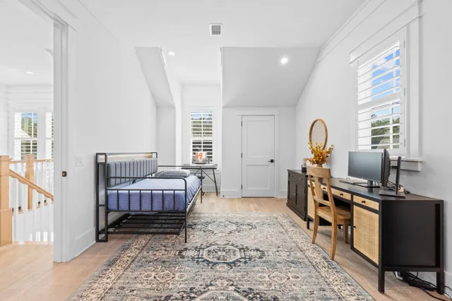 a bedroom with a bed and a dresser