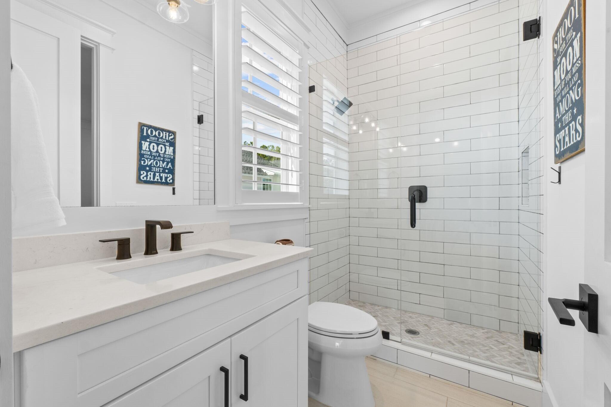 92 Rosecourt Street Inlet Beach, FL 32461 - Photo 37 of 65 a bathroom with a sink a toilet and shower