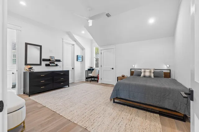a view of a patio with table and chairs and floor to ceiling window with wooden floor