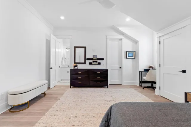 a living room with furniture wooden floor and a flat screen tv