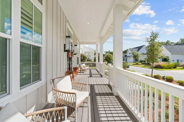 a view of a balcony with wooden floor
