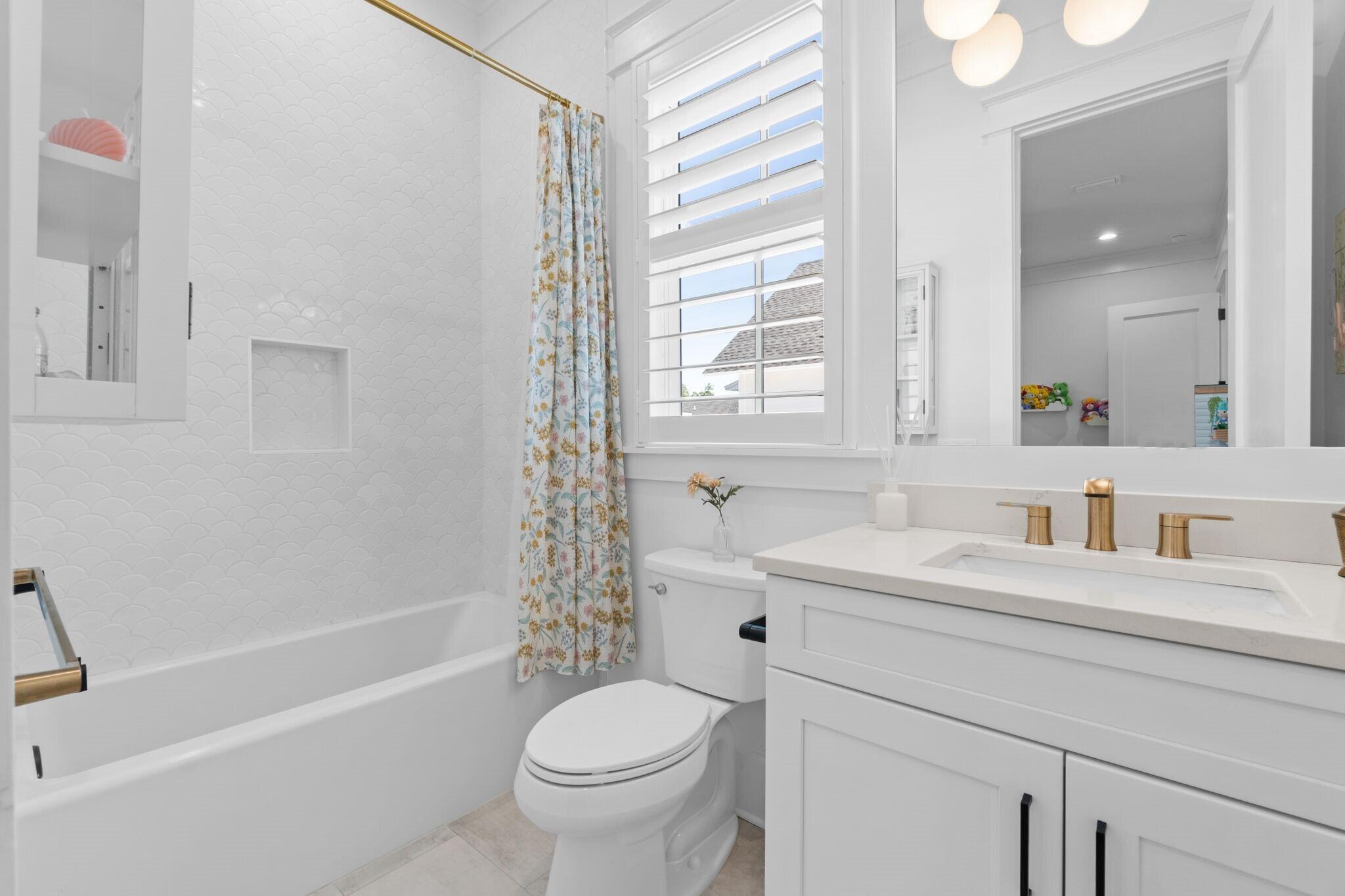 92 Rosecourt Street Inlet Beach, FL 32461 - Photo 41 of 65 a bathroom with a sink toilet vanity and tub