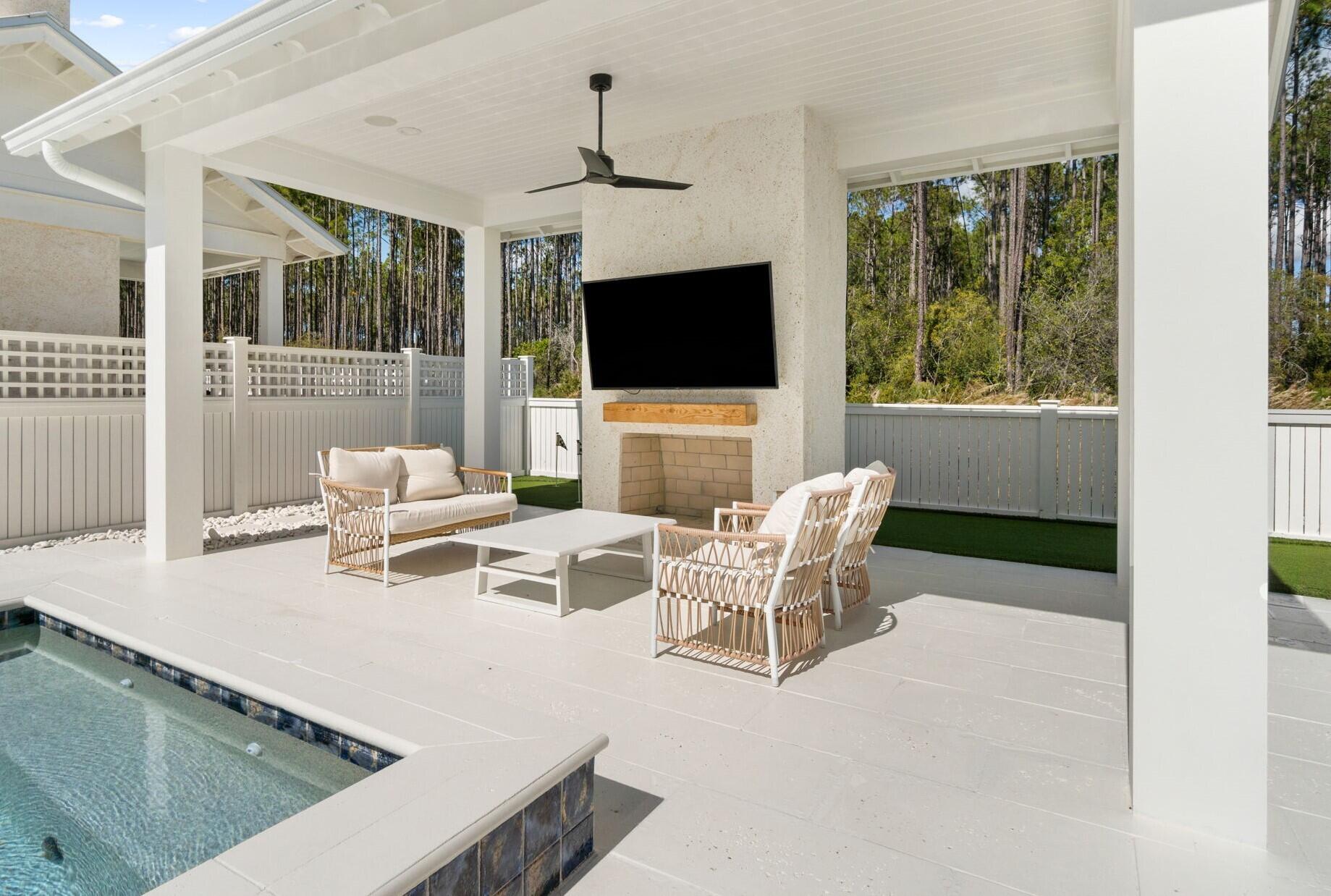 92 Rosecourt Street Inlet Beach, FL 32461 - Photo 45 of 65 a living room with furniture wooden floor and a flat screen tv