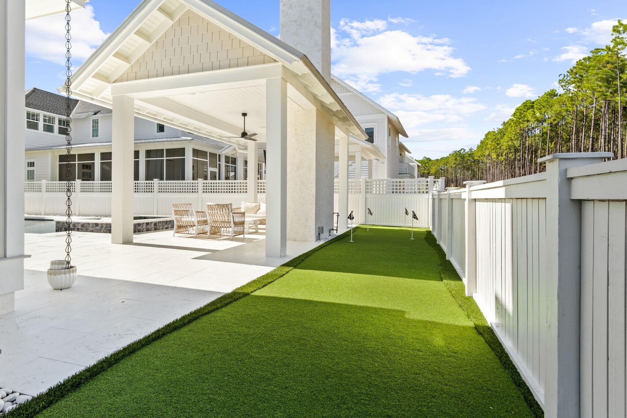 92 Rosecourt Street Inlet Beach, FL 32461 - Photo 51 of 65 a view of a house with backyard and a patio