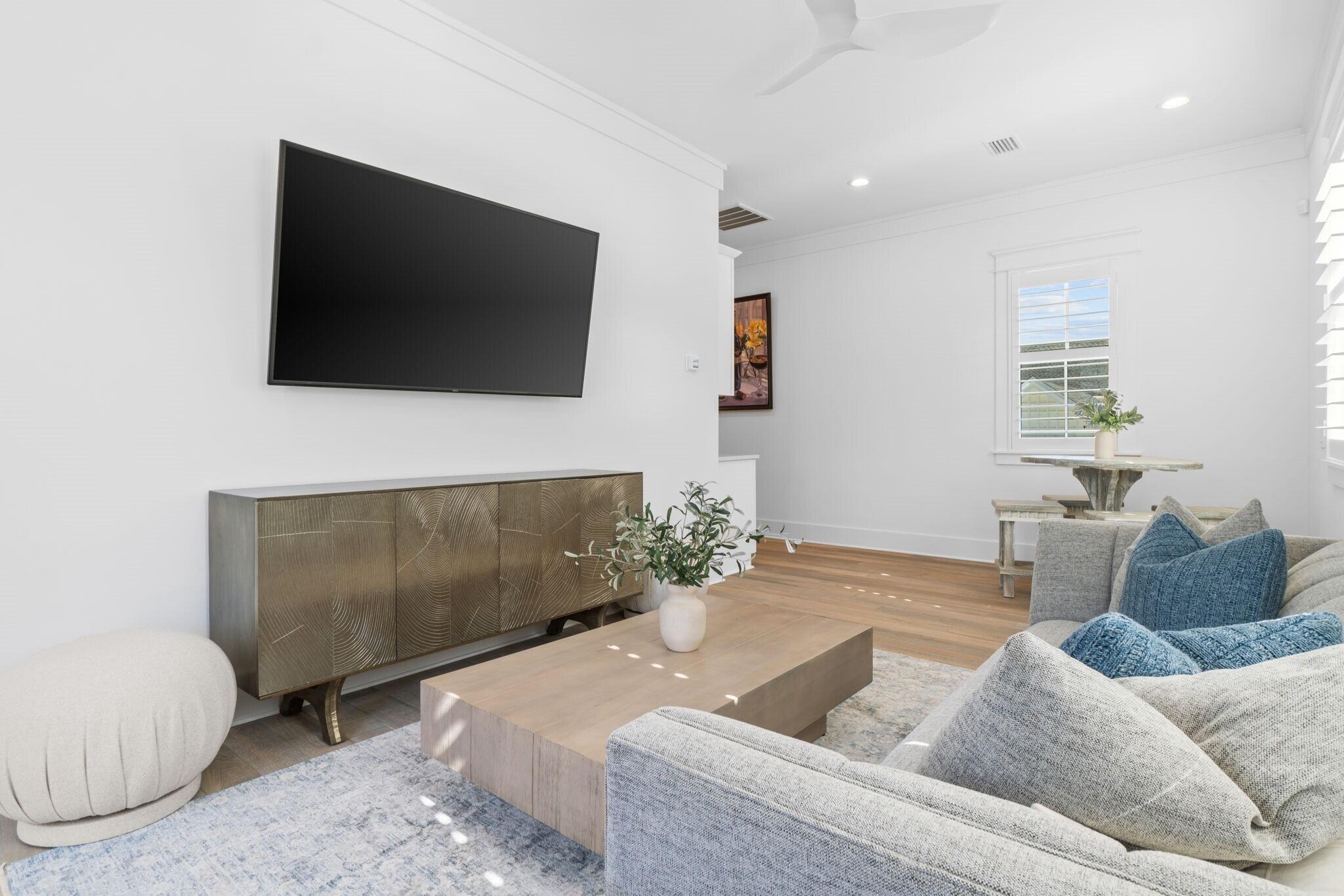 92 Rosecourt Street Inlet Beach, FL 32461 - Photo 54 of 65 a living room with furniture and a flat screen tv
