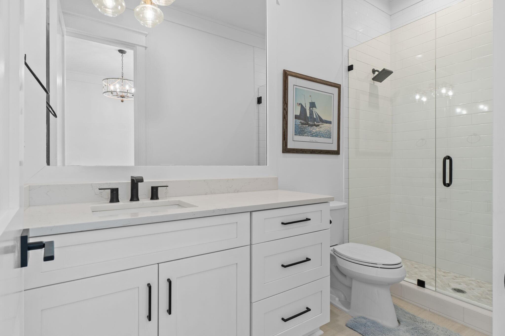 92 Rosecourt Street Inlet Beach, FL 32461 - Photo 56 of 65 a bathroom with a toilet a sink and mirror