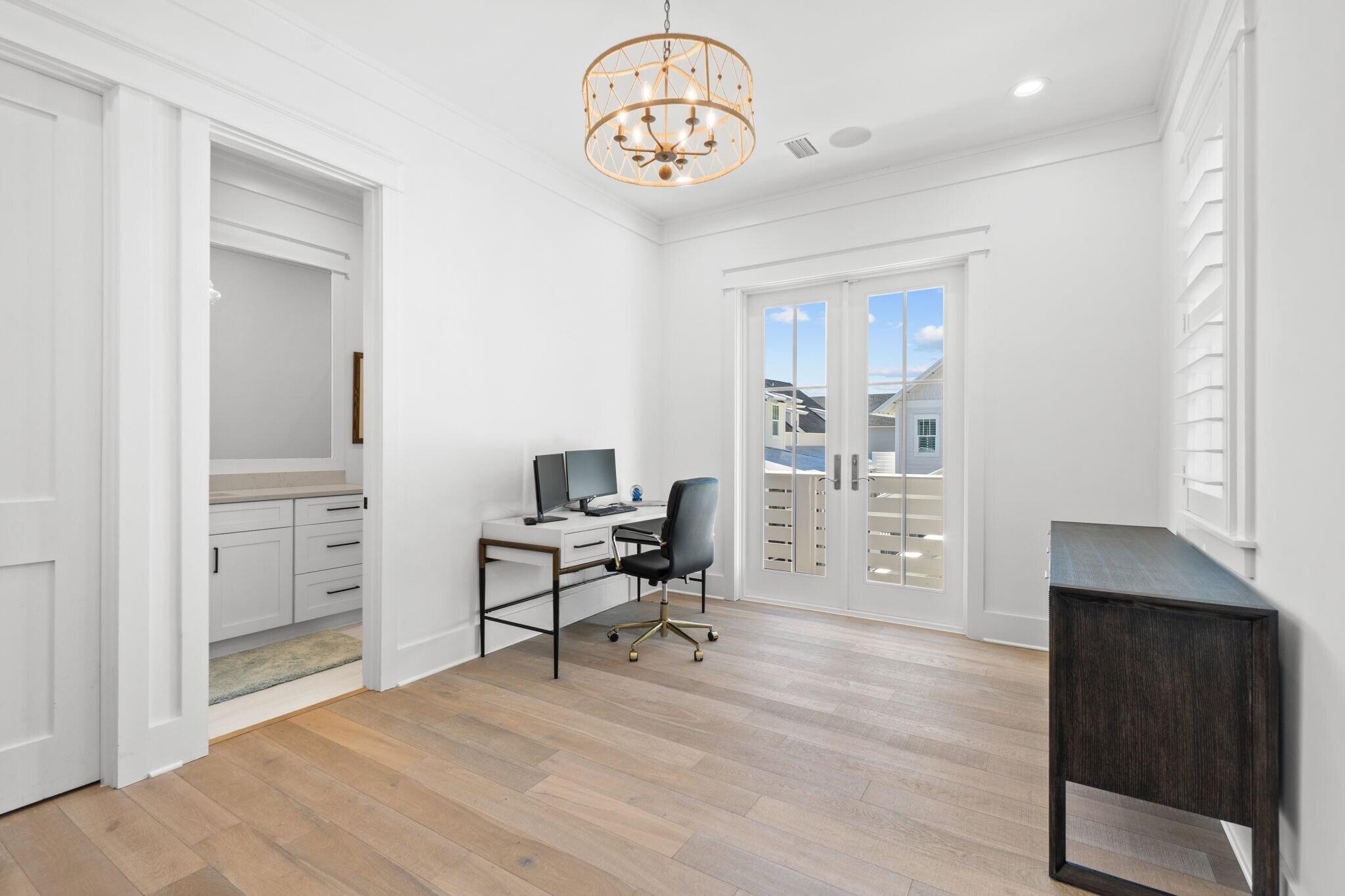 92 Rosecourt Street Inlet Beach, FL 32461 - Photo 57 of 65 a view of a workspace with furniture and a window