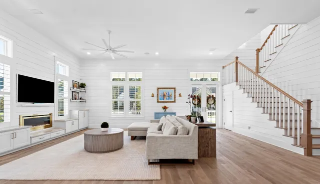 a living room with furniture and a flat screen tv