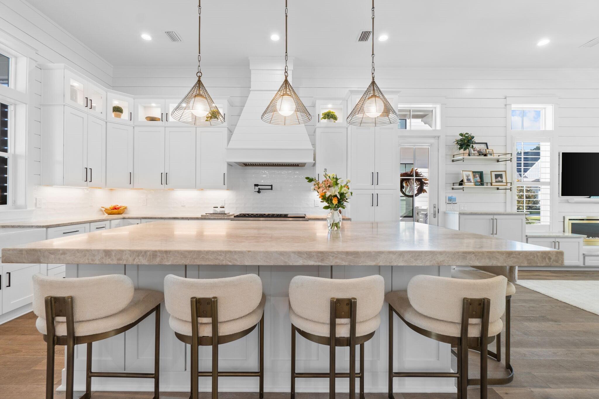 92 Rosecourt Street Inlet Beach, FL 32461 - Photo 9 of 65 a kitchen with cabinets and chairs