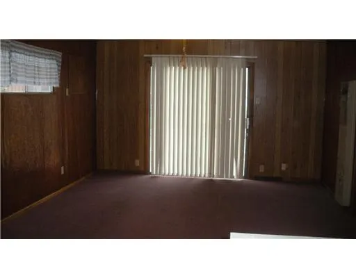 a black and white photo of a living room