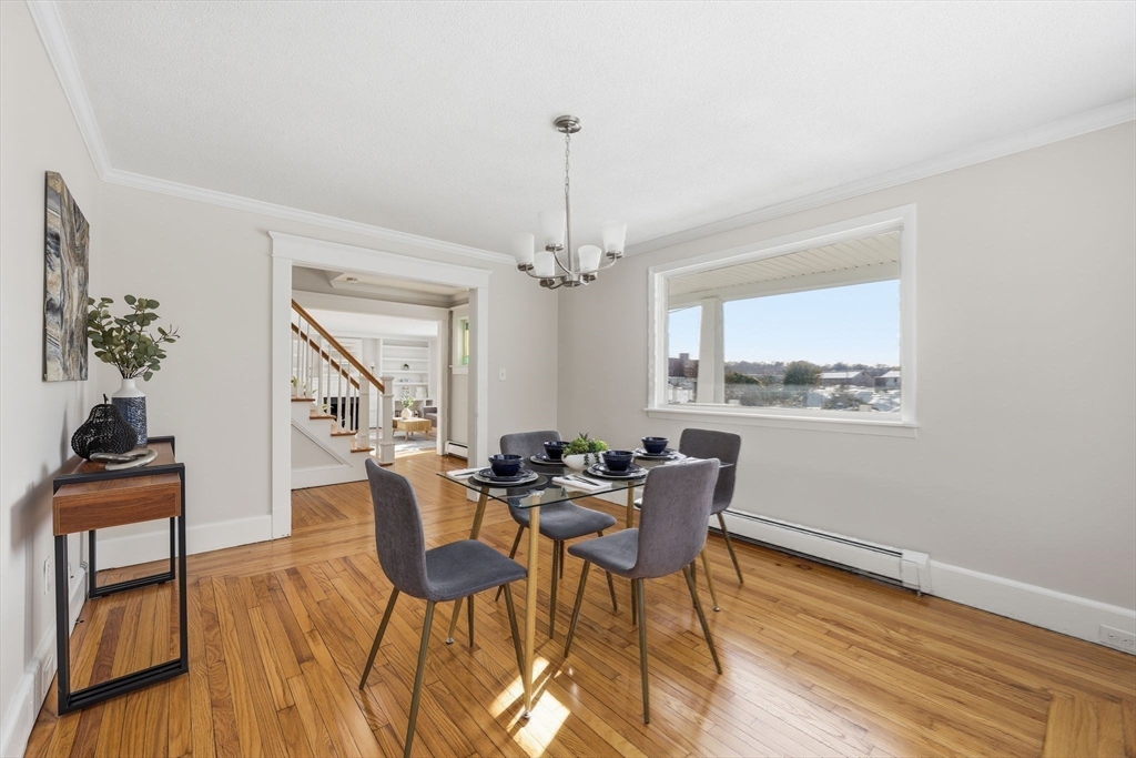 2 Cycle Street Westfield, MA 01085 - Photo 14 of 30 a dining room with furniture a chandelier and wooden floor