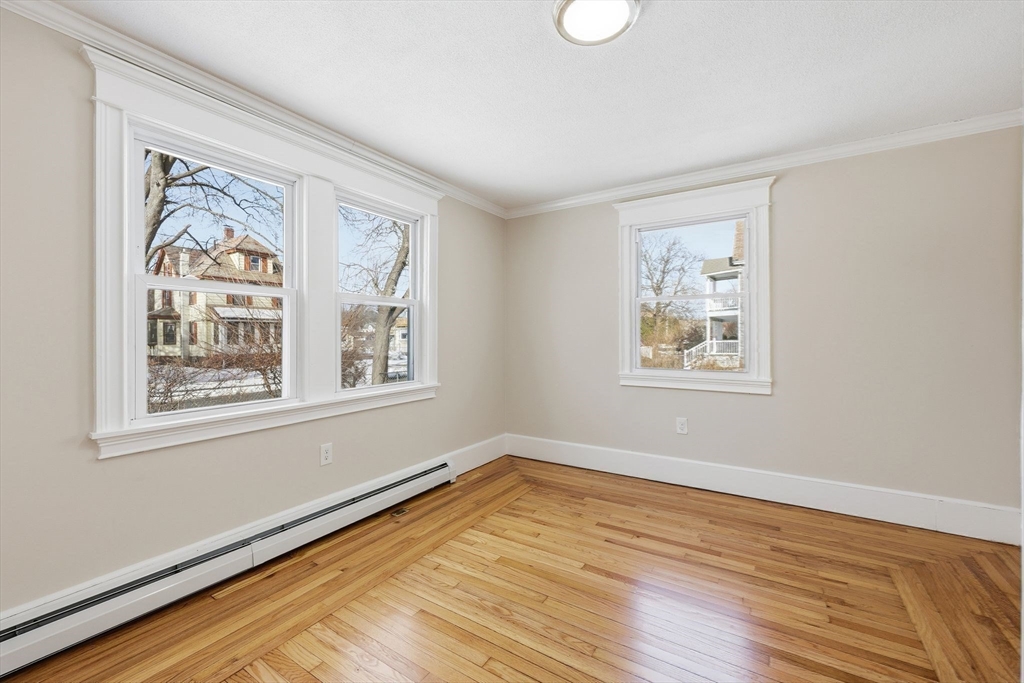 2 Cycle Street Westfield, MA 01085 - Photo 16 of 30 a view of an empty room with wooden floor and a window