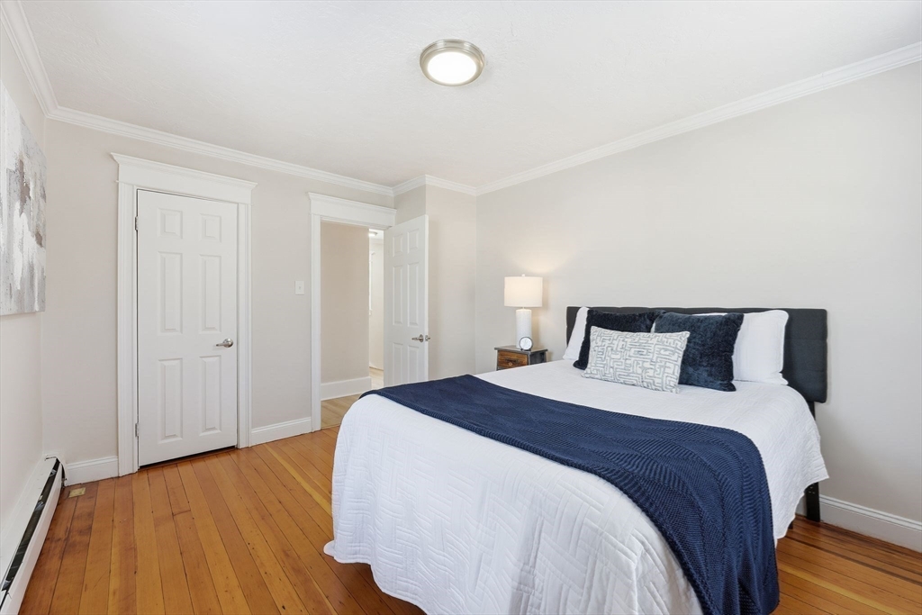 2 Cycle Street Westfield, MA 01085 - Photo 18 of 30 a bedroom with a bed and wooden floor