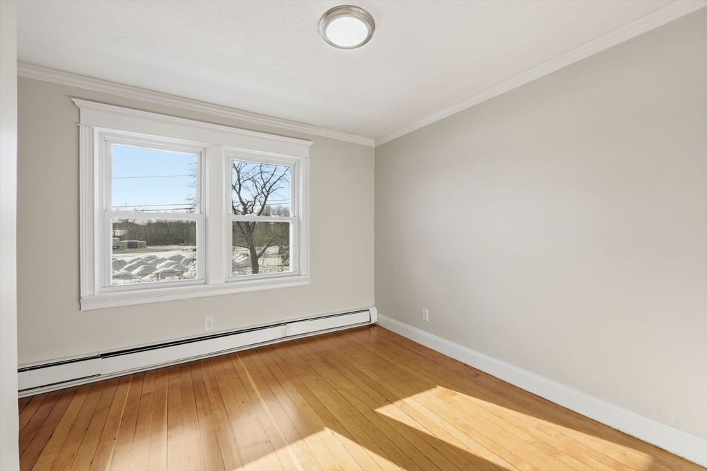 2 Cycle Street Westfield, MA 01085 - Photo 24 of 30 a view of an empty room with wooden floor and a window