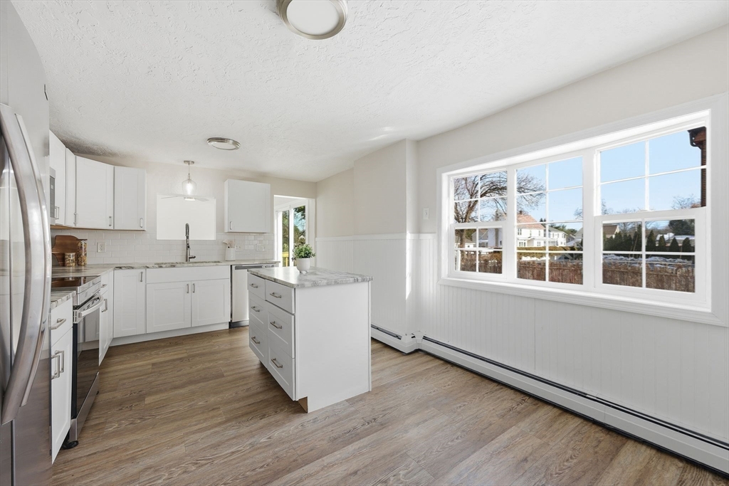 2 Cycle Street Westfield, MA 01085 - Photo 10 of 30 a kitchen with white cabinets and white appliances