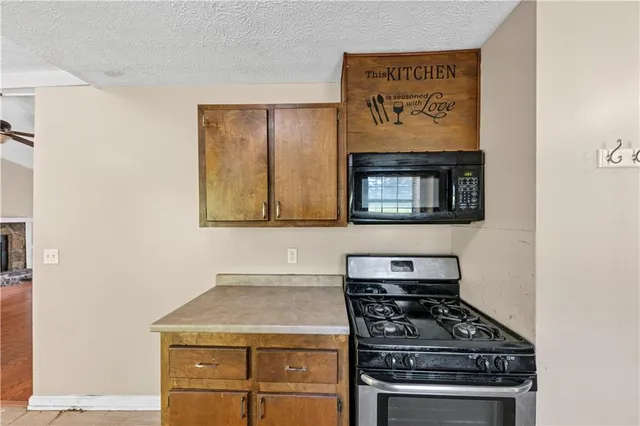 a kitchen with a stove and a microwave