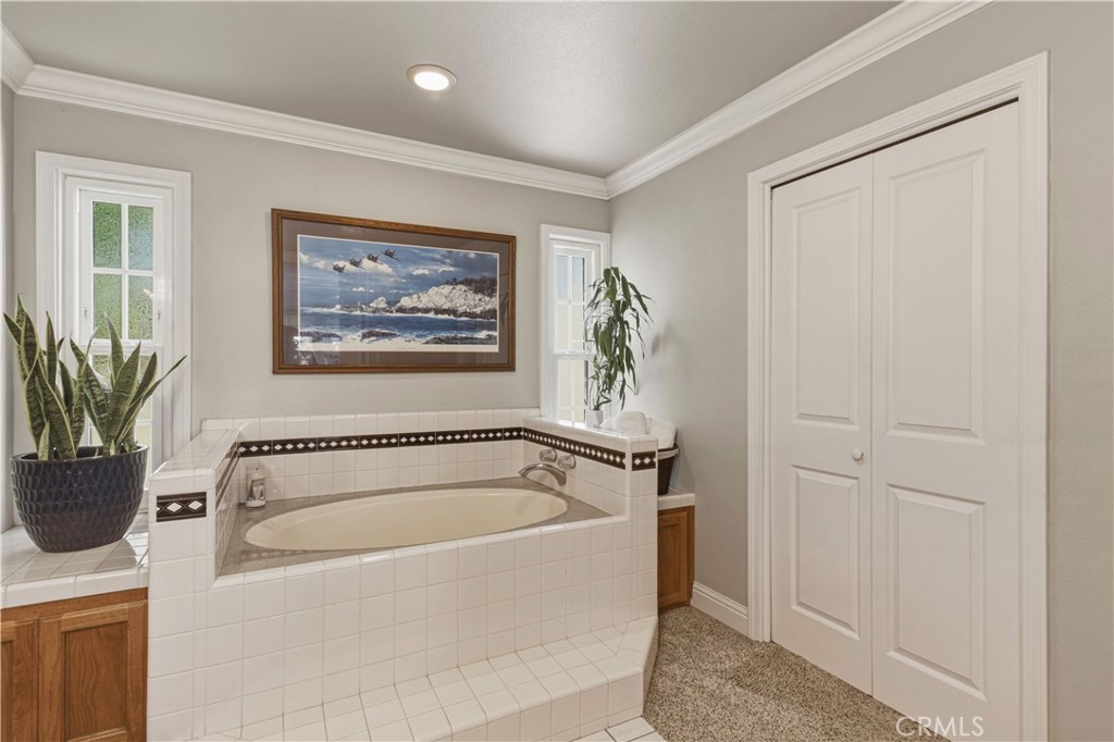 3856 North Gardner Avenue Merced, CA 95340 - Photo 26 of 59 a white bath tub sitting in a spacious bathroom next to a window