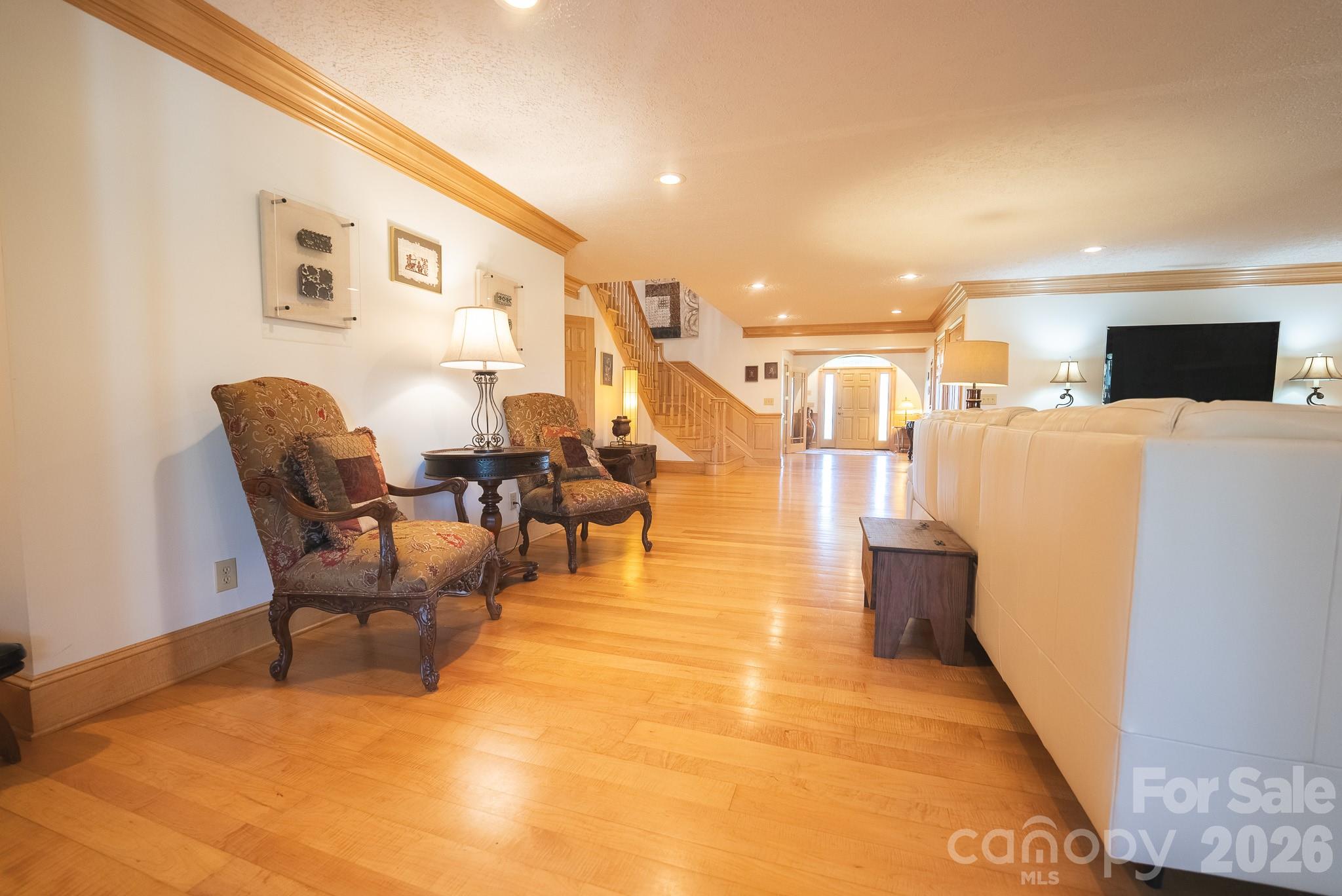 6985 Junaluska Road Boone, NC 28607 - Photo 10 of 35 a living room with couches and kitchen view with wooden floor