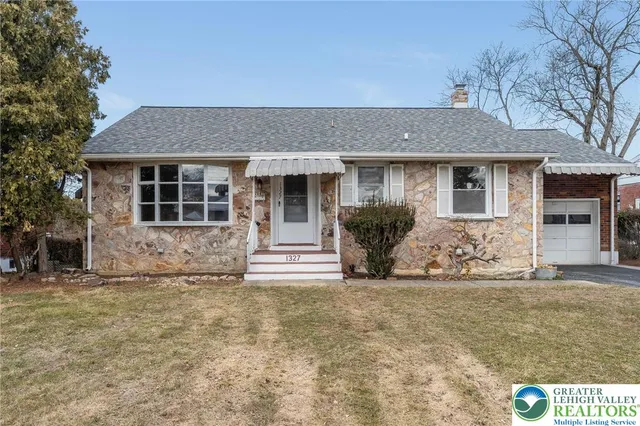 front view of a house with yard