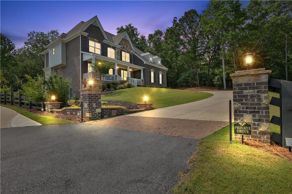 2330 Trammel Road Cumming, GA 30041 - Photo 1 of 1 a front view of a house with a yard