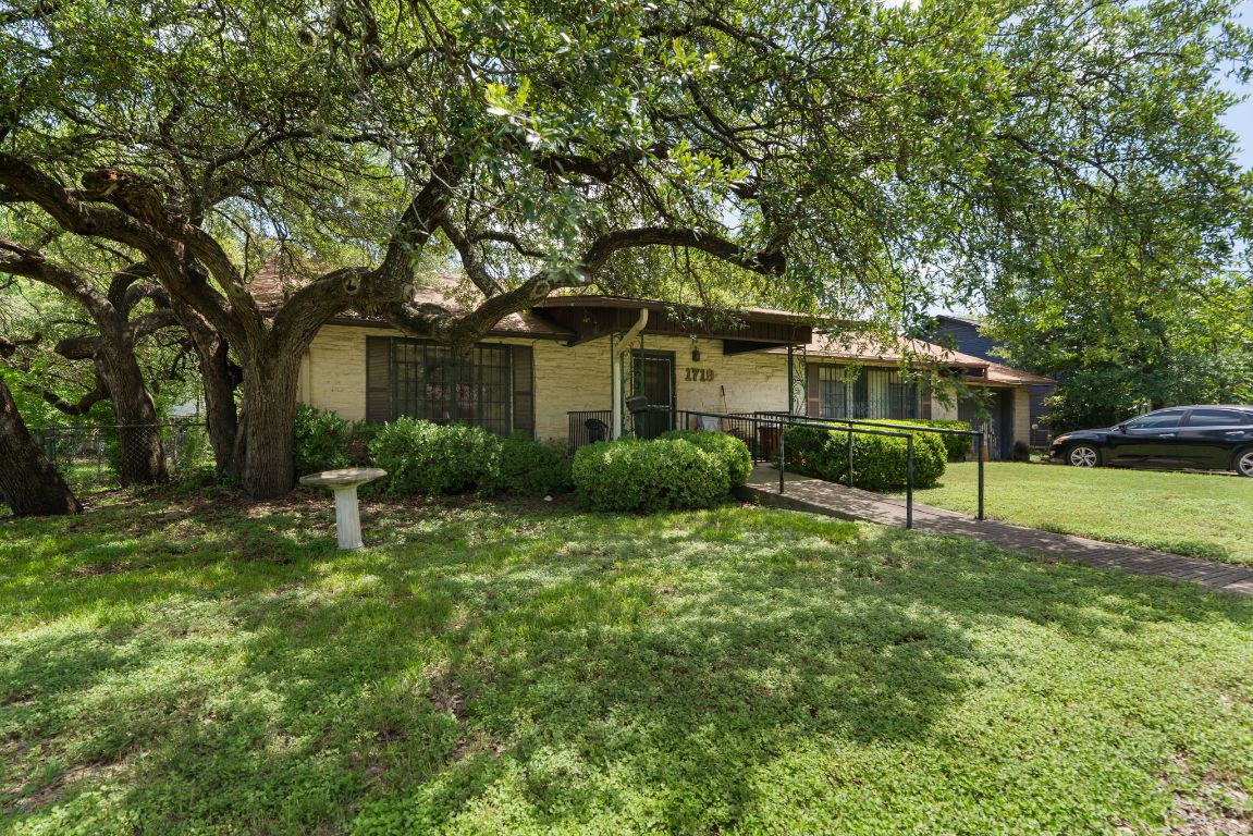 1719 East 32nd Street Austin, TX 78722 - Photo 2 of 13 a front view of a house with a yard