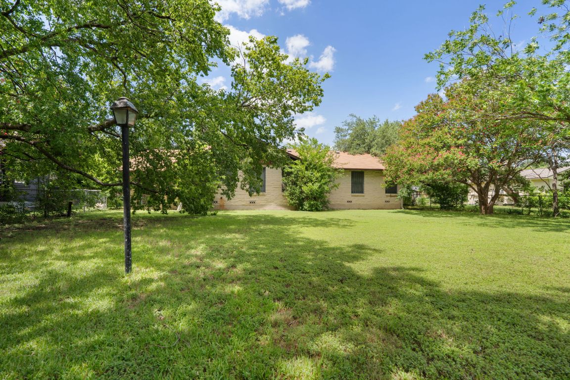 1719 East 32nd Street Austin, TX 78722 - Photo 7 of 13 a view of a house with a yard