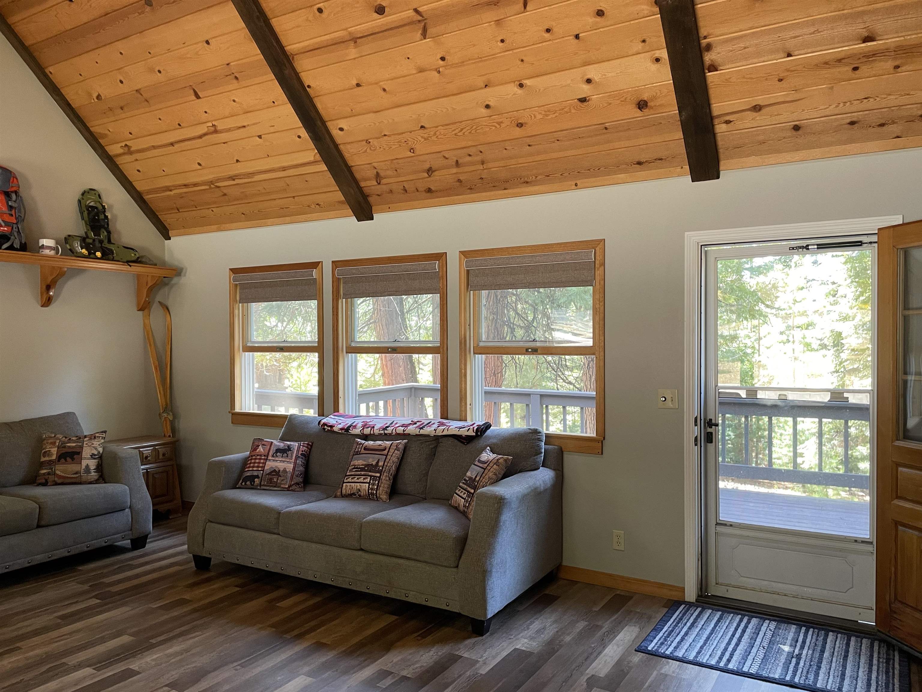603 East Burnt Cedar Road Lake Almanor, CA 96137 - Photo 6 of 33 a living room with furniture a wooden floor and a window