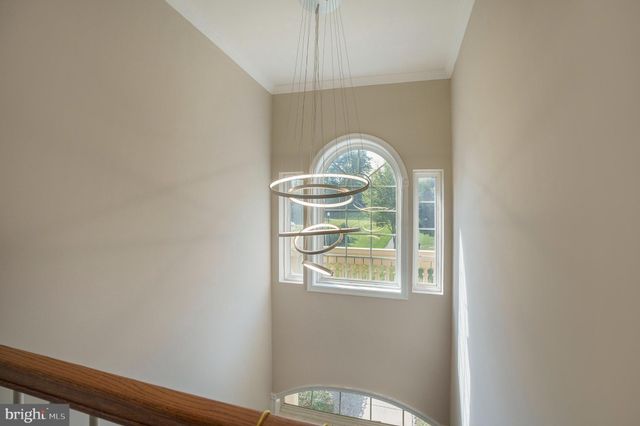 a bathroom with a bathtub sink vanity and mirror