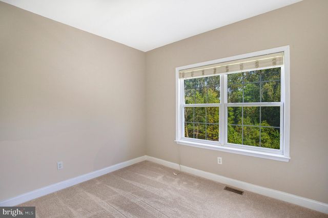 a view of empty room with windows