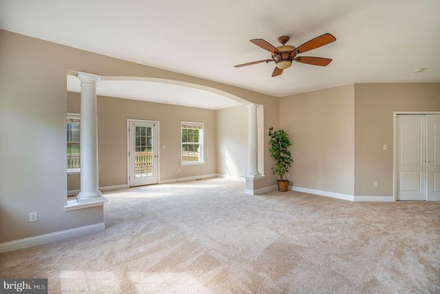 a bathroom with a bathtub sink and mirror