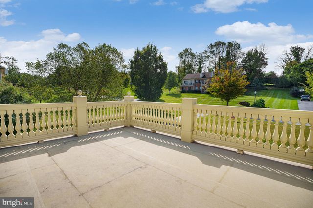 a view of balcony with wooden floor and fence