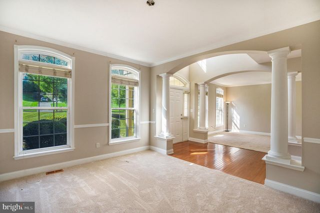 a view of an empty room with a fireplace