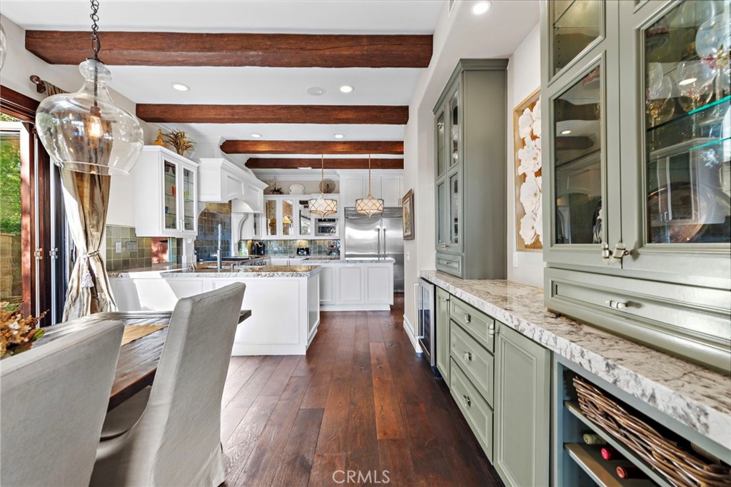 18651 Topanga Canyon Road Silverado, CA 92676 - Photo 13 of 55 a kitchen with stainless steel appliances granite countertop lots of counter top space and wooden floor