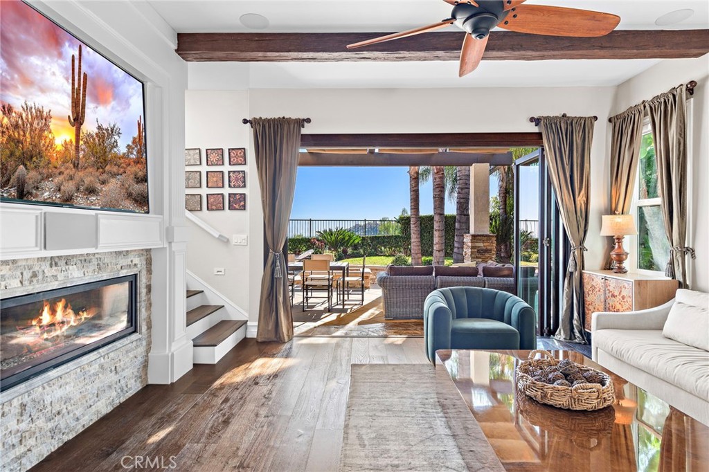 18651 Topanga Canyon Road Silverado, CA 92676 - Photo 18 of 55 a living room with furniture a fireplace and a floor to ceiling window
