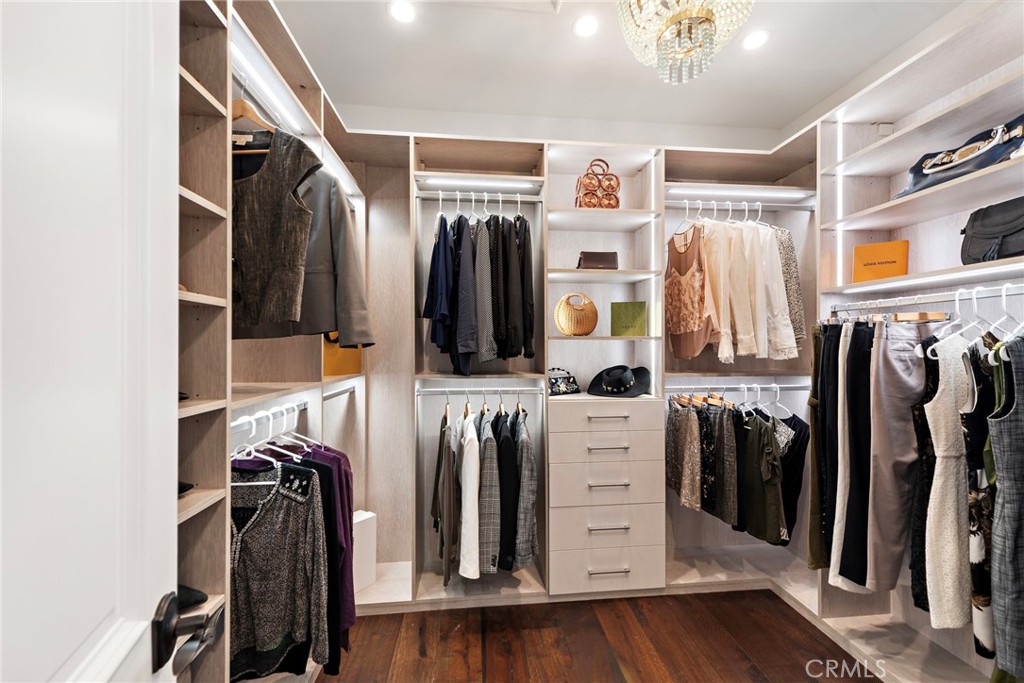 18651 Topanga Canyon Road Silverado, CA 92676 - Photo 31 of 55 a view of walk in closet with clothes and shoes
