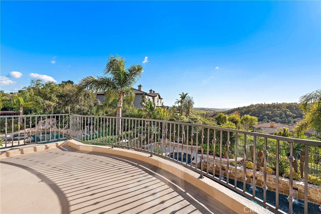 18651 Topanga Canyon Road Silverado, CA 92676 - Photo 32 of 55 a view of a balcony with a floor to ceiling window and wooden fence