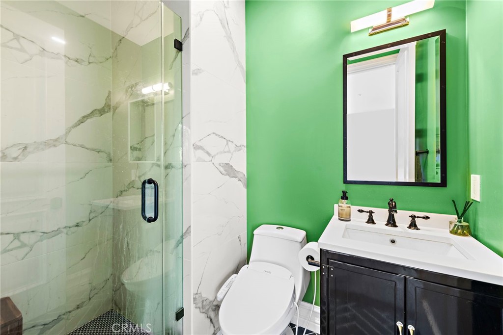 18651 Topanga Canyon Road Silverado, CA 92676 - Photo 34 of 55 a bathroom with a sink a toilet and shower