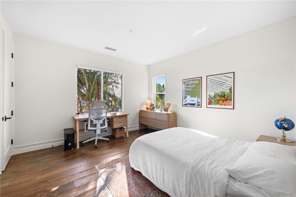 18651 Topanga Canyon Road Silverado, CA 92676 - Photo 35 of 55 a bedroom with a bed a table and a window