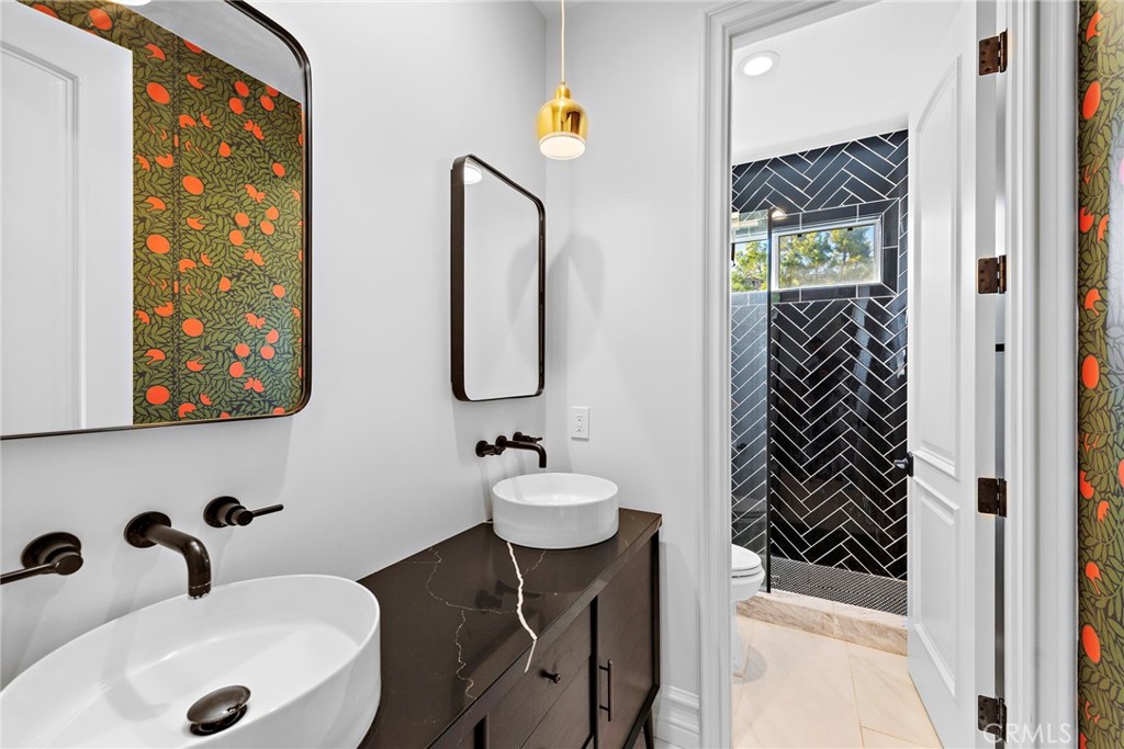 18651 Topanga Canyon Road Silverado, CA 92676 - Photo 39 of 55 a bathroom with a sink and a mirror