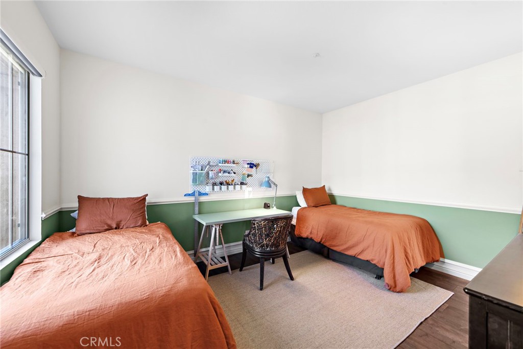 18651 Topanga Canyon Road Silverado, CA 92676 - Photo 42 of 55 a bedroom with a bed and a dresser