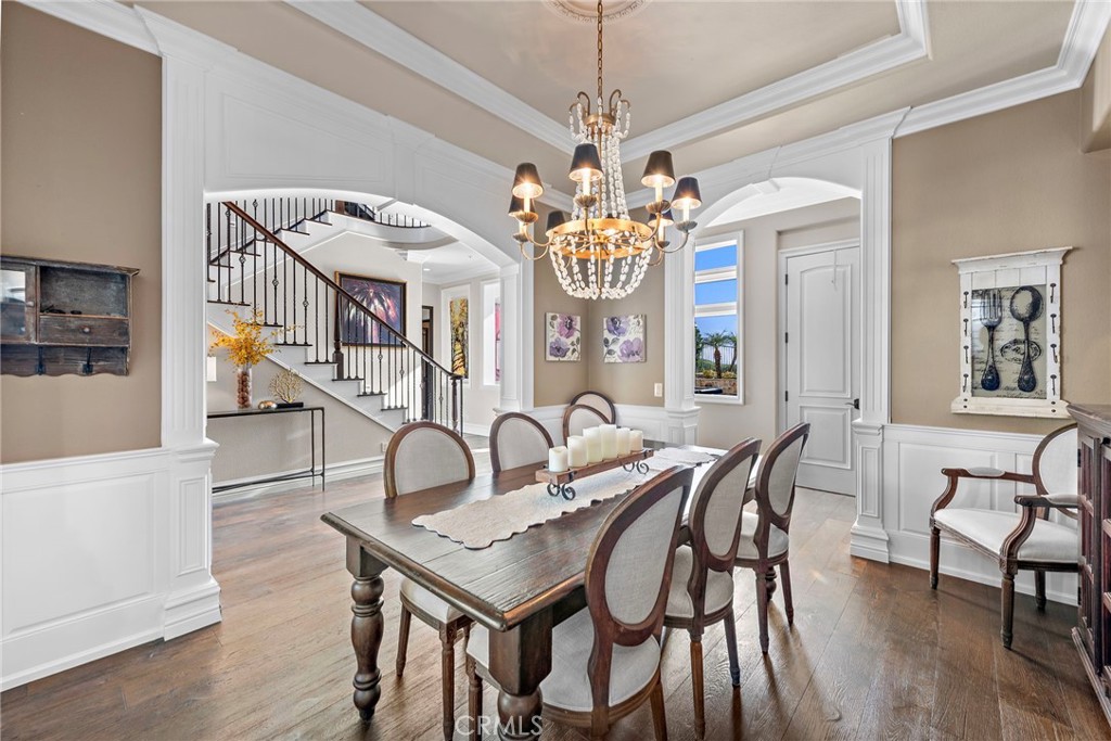 18651 Topanga Canyon Road Silverado, CA 92676 - Photo 8 of 55 a view of a dining room with furniture a chandelier and wooden floor