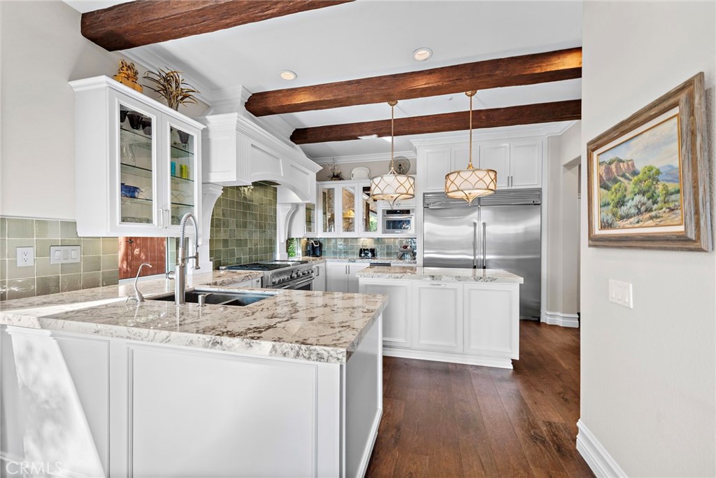 18651 Topanga Canyon Road Silverado, CA 92676 - Photo 9 of 55 a kitchen with granite countertop a sink and cabinets