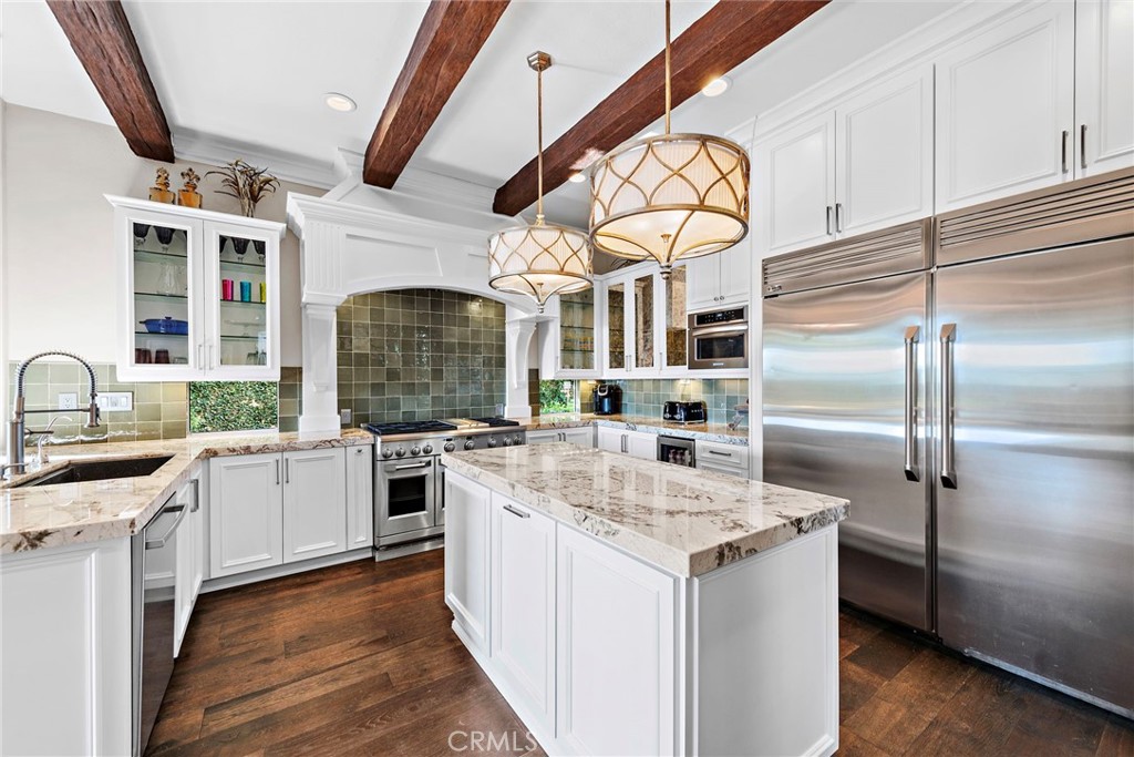 18651 Topanga Canyon Road Silverado, CA 92676 - Photo 10 of 55 a kitchen with stainless steel appliances granite countertop a stove and a sink