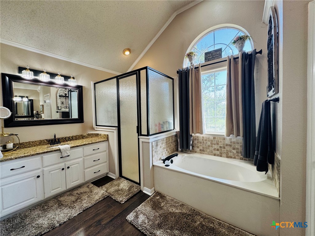 115 Oak Ridge Road Gatesville, TX 76528 - Photo 19 of 37 a bathroom with a tub sink and mirror
