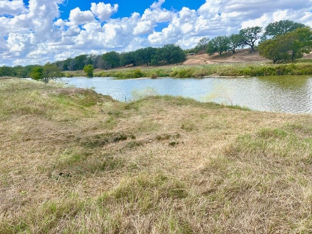 385 Ranch Road 1 Stonewall, TX 78671 - Photo 3 of 20 a view of a lake with houses in the back