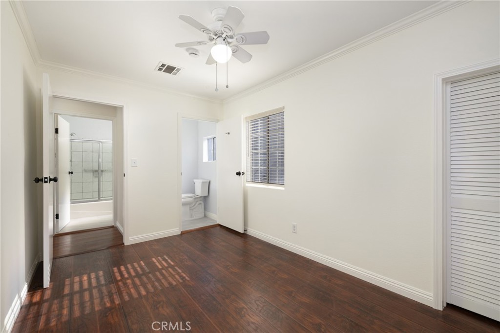 3920 Elma Road Pasadena, CA 91107 - Photo 21 of 29 a view of an empty room with wooden floor and a window