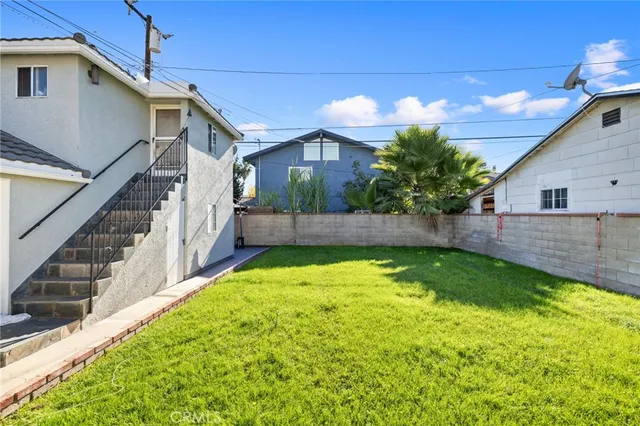 a view of a back yard of the house